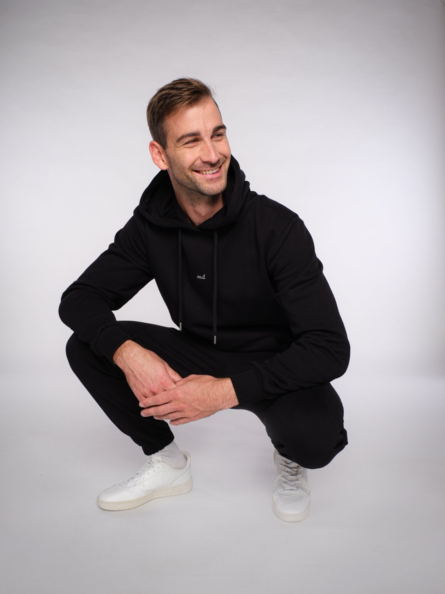 Unisex Hoodie REAL (schwarz)
